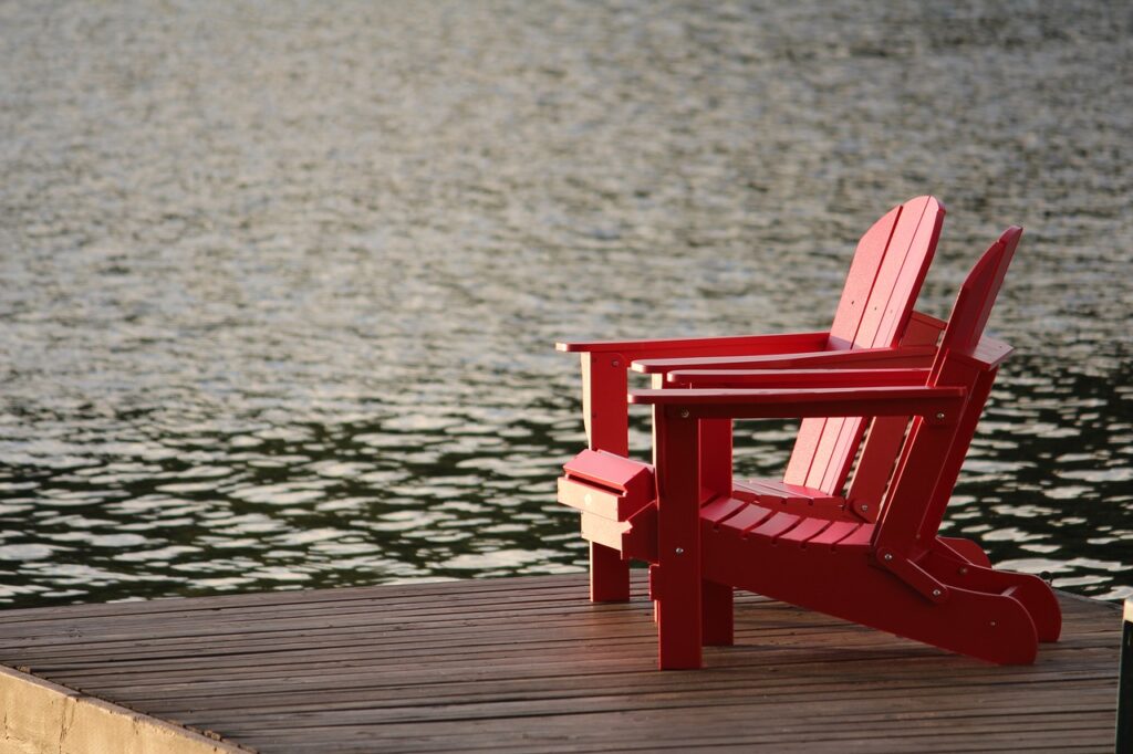 Chairs on a lake dock.