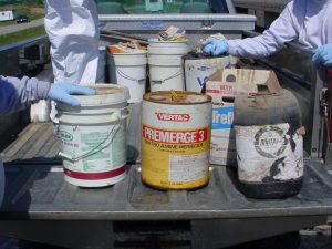 Pesticides in the back of a pickup truck.